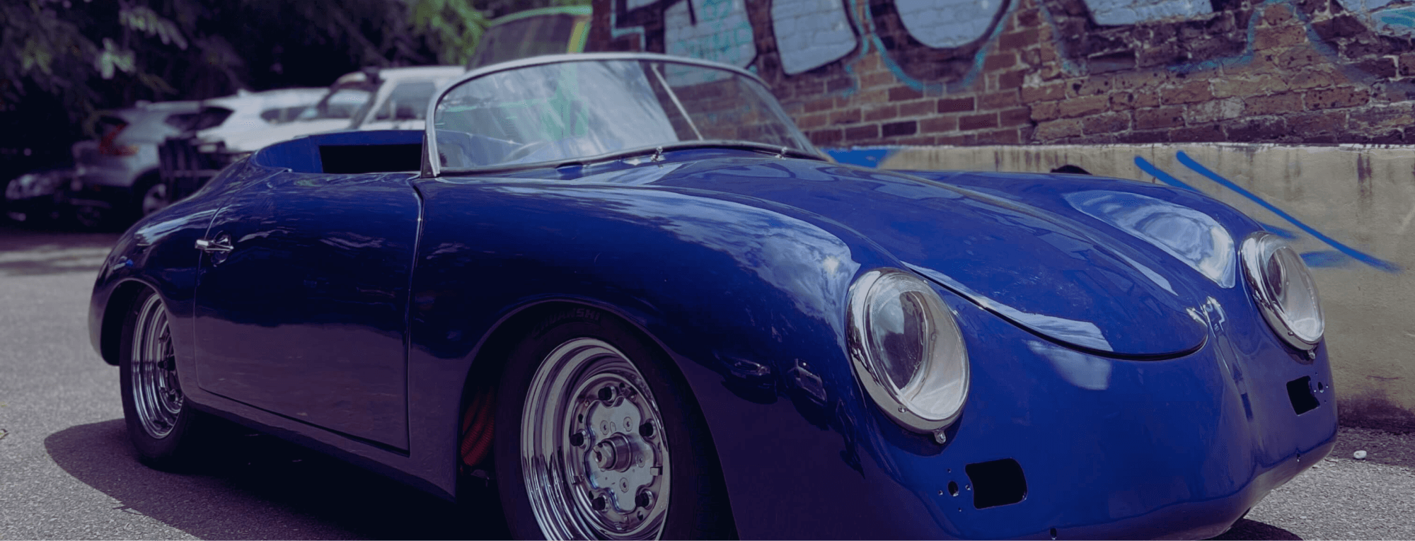 A blue Porsche 365 Tribute Fully Electric solar powered vehicle.