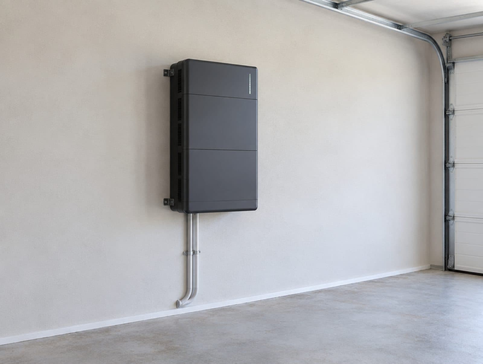 A home battery wall mounted in a garage, clear of the door and with nothing stored beneath it