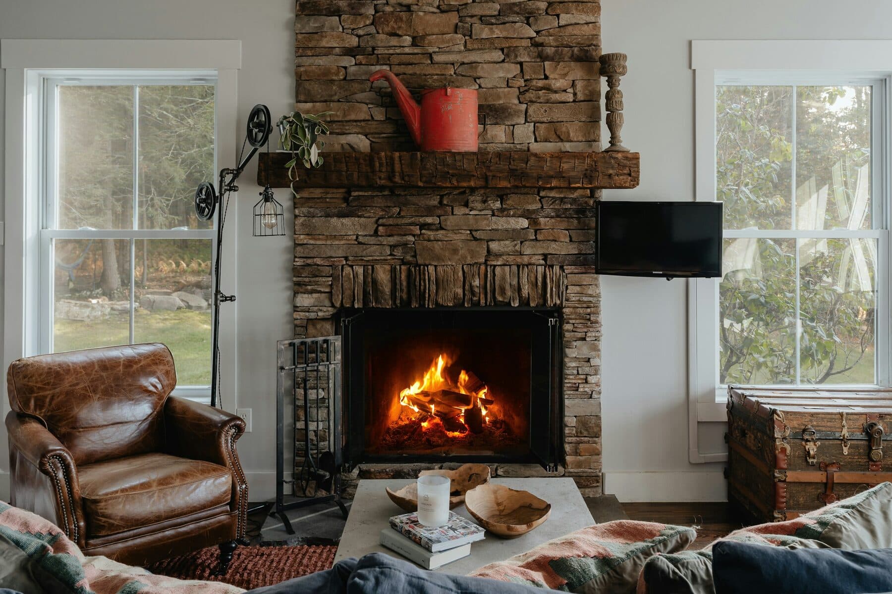 A warm living room with a fireplace in winter