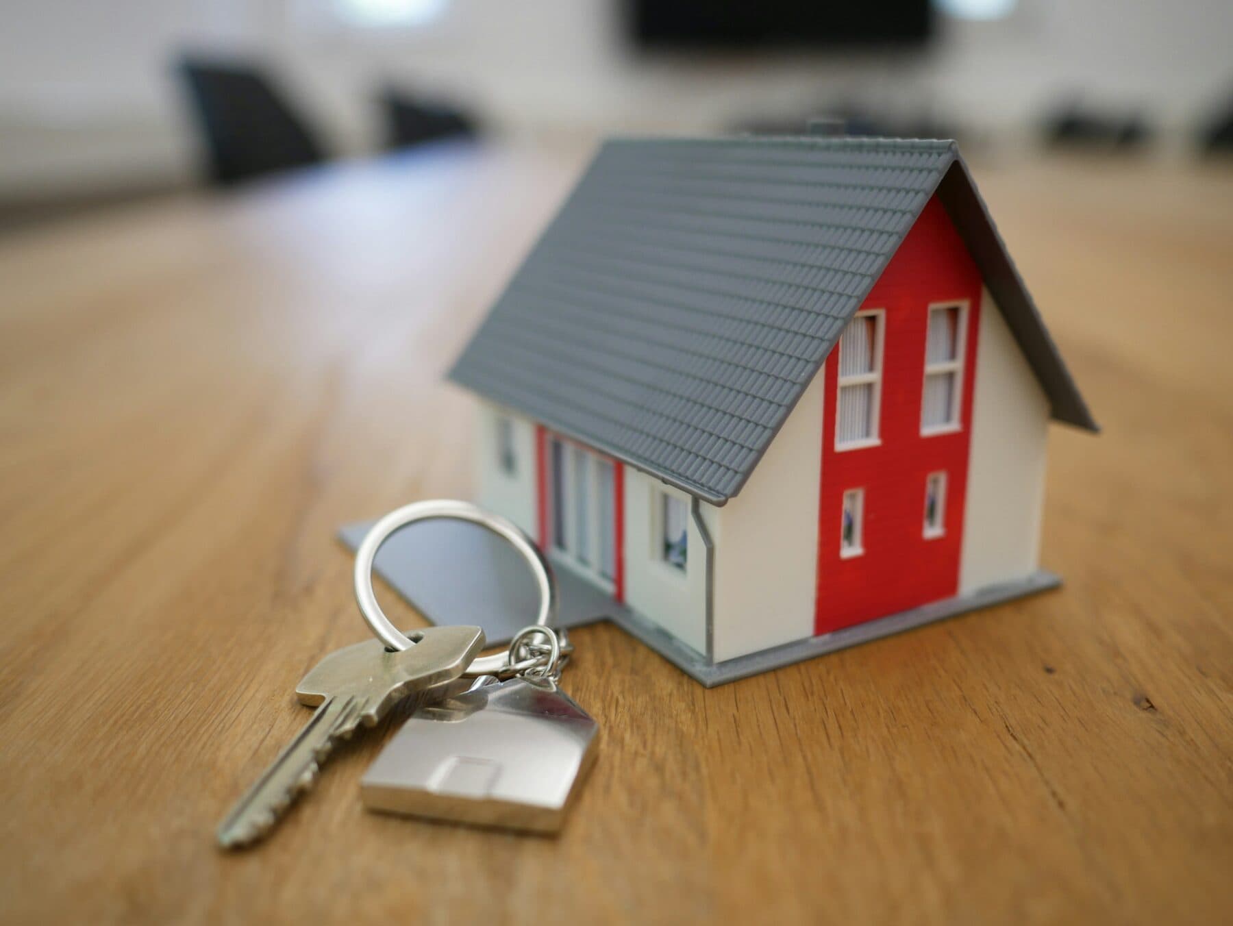 A model house with a set of keys